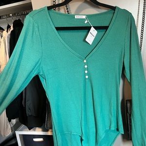 Green long sleeve ribbed button up bodysuit